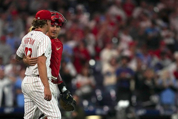 Nolan Hoffman #47 and J.T. Realmuto #10 of the Philadelphia Phillies embrace after the game against the Seattle Mariners at Citizens Bank Park 