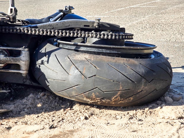 Closeup burnet out motorcycle, background with copy space