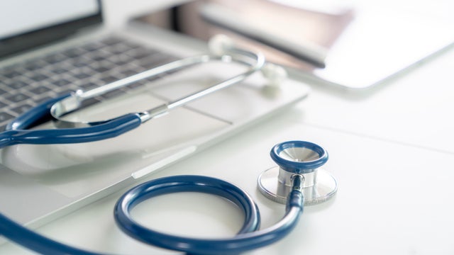 A stethoscope is placed on a doctor's desk in a hospital 