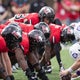 NIU and Holy Cross trade 4th-quarter kickoff-return TDs before Huskies win 19-17 