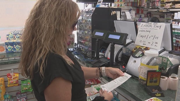 Yarnell looks at her tickets in the store
