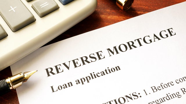 Reverse mortgage loan application on a table. 