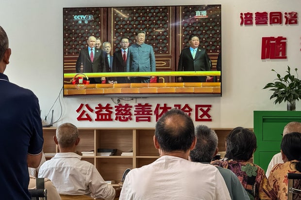 Elderly Residents Watch Victory Day Parade Broadcast In Chongqing 