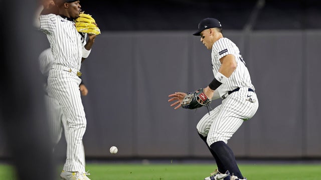 New York Yankees outfielder Aaron Judge, right and Jazz Chisholm Jr. watch a single hit by Toronto Blue Jays' Bo Bichette fall between them during the fifth inning of a baseball game Friday, Sept. 5, 2025, in New York. 