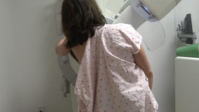 A woman gets a mammogram 