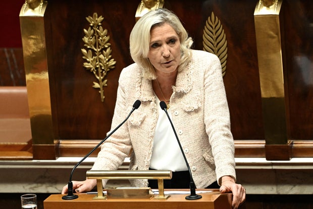 Marine Le Pen delivers a speech before a vote of confidence on the austerity budget for the government in the National Assembly in Paris on September 8, 2025. 