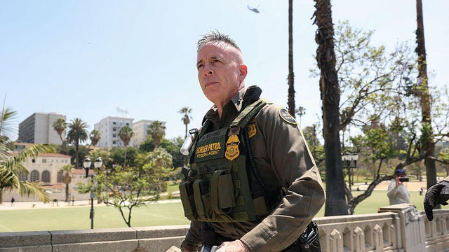 Gregory Bovino walks as a large group of federal law enforcement officers arrive at MacArthur Park in Los Angeles on July 7, 2025. 