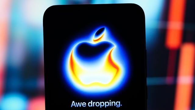 In this photo illustration, the Apple logo "Awe Dropping 