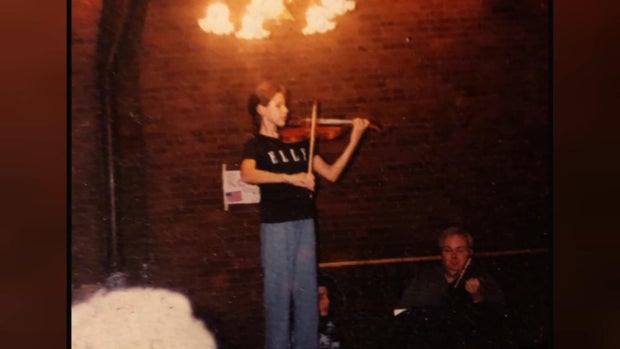 Magee Capsouto as a child playing violin 