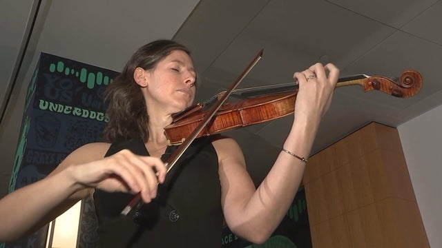 Magee Capsuoto plays her violin in the Great Hall at CBS News Philadelphia 