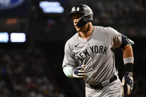 Aaron Judge #99 of the New York Yankees reacts after hitting a solo home run against the Boston Red Sox during the first inning at Fenway Park on September 12, 2025 in Boston, Massachusetts. 