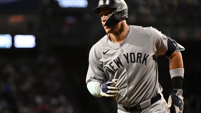 Aaron Judge #99 of the New York Yankees reacts after hitting a solo home run against the Boston Red Sox during the first inning at Fenway Park on September 12, 2025 in Boston, Massachusetts. 