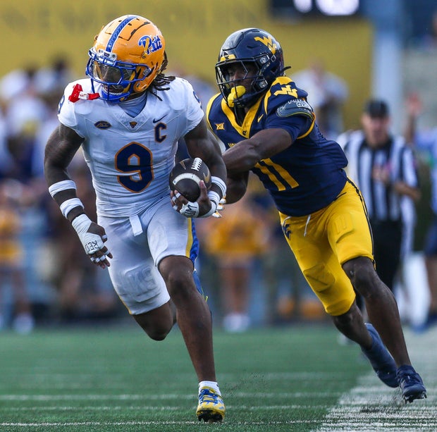 kyle-louis-interception-chased-by-justin-smith-brown.jpg 