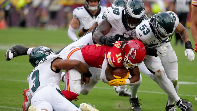 Kansas City Chiefs running back Isiah Pacheco is tackled by Philadelphia Eagles' Nolan Smith, Jordan Davis and Zack Baun 