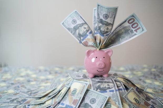 Stuffed piggy bank with US dollars 