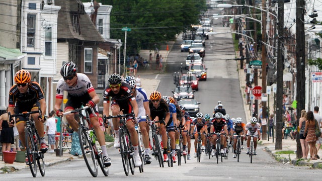 Cyclists ride up a hill in the Philly Cycling Classic men's race, in 2013 in Philadelphia. 