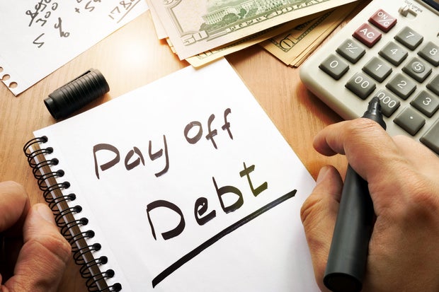Note with words pay off debt concept. 
