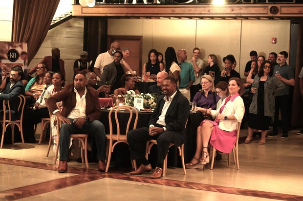 People pose for photos during the KB Foundation's BBQ Experience event