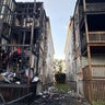 Firefighter, resident taken to hospital after large fire at 2 homes in Boston 