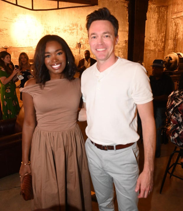 People pose for photos during the KB Foundation's BBQ Experience event