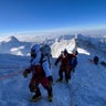 Everest record, off-duty lifesaver and a rescued raccoon 