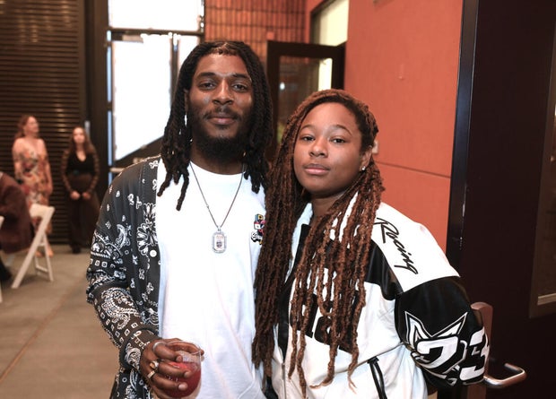 People pose for photos at Mud Ball 2025