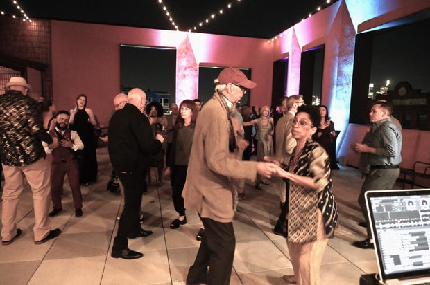 People pose for photos at Mud Ball 2025