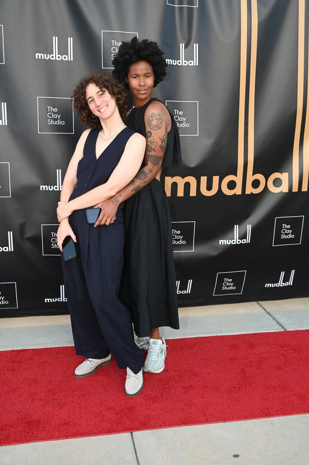 People pose for photos at Mud Ball 2025