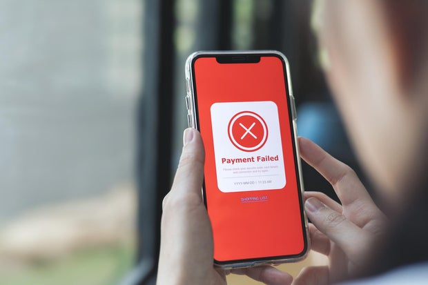 Payment failed, declined. Red online financial transaction notification in application showing error on smartphone. 