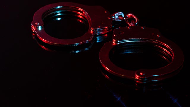 Handscuffs at Night with Red and Blue Light 
