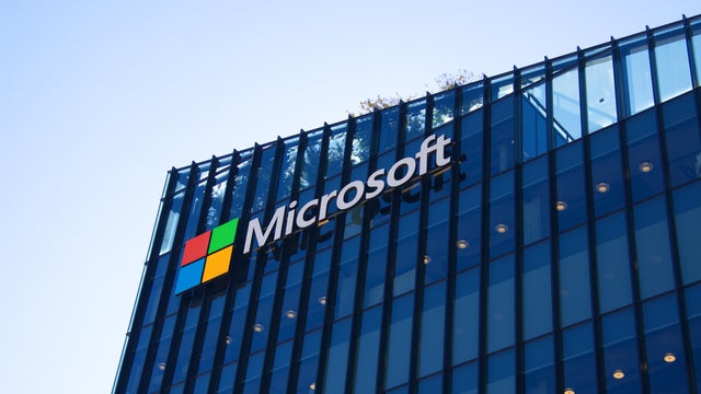 Big letters on the grass - Microsoft. Logo of a computer corporation at the entrance to the building 