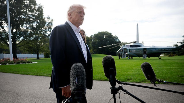 President Trump speaks to members of the media as he departs the White House in Washington, D.C., on Sept. 26, 2025. 