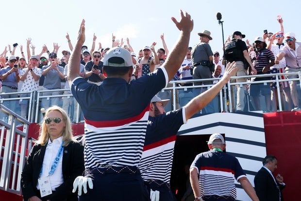 Xander Schauffele and Patrick Cantlay of Team United States walk off the 18th green after defeating Viktor Hovland and Robert MacIntyre of Team Europe 2 Up during the Friday morning foursomes matches of the 2025 Ryder Cup at Black Course at Bethpage State Park Golf Course on September 26, 2025 in Farmingdale, New York.