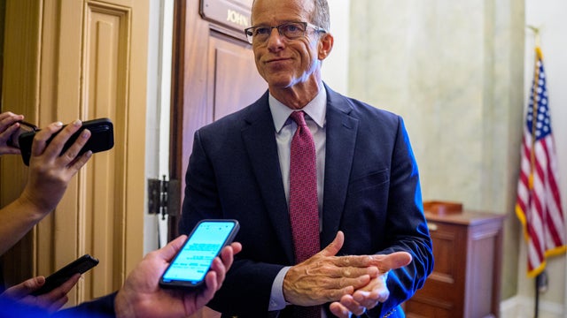 Senate Majority Leader John Thune takes a question from a reporter outside his office at the U.S. Capitol Building on September 18, 2025 in Washington, D.C. 