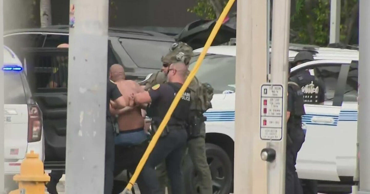Man arrested after barricading himself inside SUV at Miami gas station ...