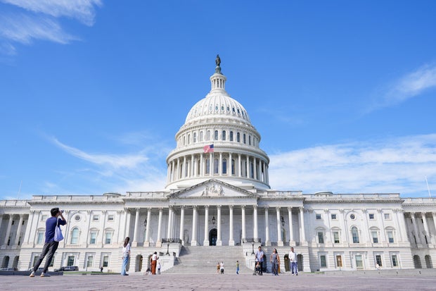Visitors walk in front of the Capitol in Washington, D.C. on Friday, Sept. 26, 2025. 