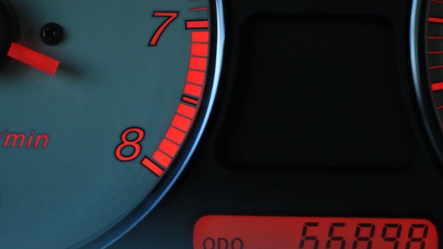 Illuminated Odometer displayed on a vehicle dashboard 
