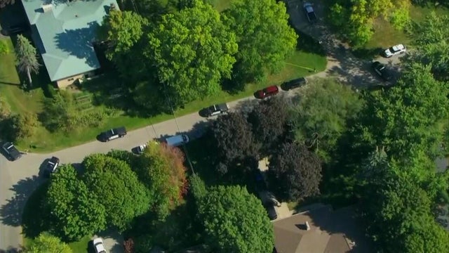 Generic police lights and yellow police tape at crime scene 