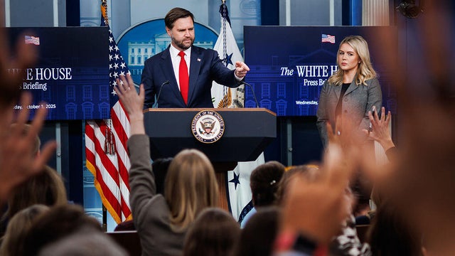 Vice President JD Vance, left, and White House press secretary Karoline Leavitt attend a news conference at the White House in Washington, D.C., on Oct. 1, 2025. 