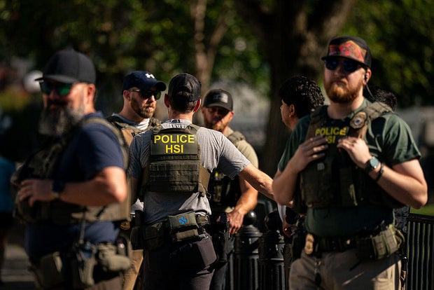 Agents from the Homeland Security Investigations unit, U.S. Park Police officers, and U.S. Secret Service Uniformed Division officers conduct a traffic stop near the White House in Washington, D.C., on Aug. 26, 2025. 