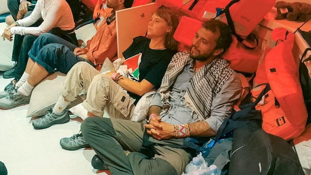 Swedish activist Greta Thunberg and Brazilian activist Thiago Avila sit in a vessel with members of the Global Sumud Flotilla, making their way to Israel 