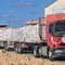 Aid trucks prepare to enter Gaza as Israel says ceasefire is in effect