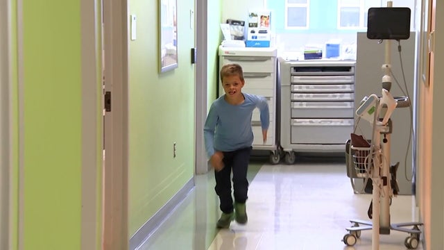 9-year-old Landon races down the hallway at his doctor's office 