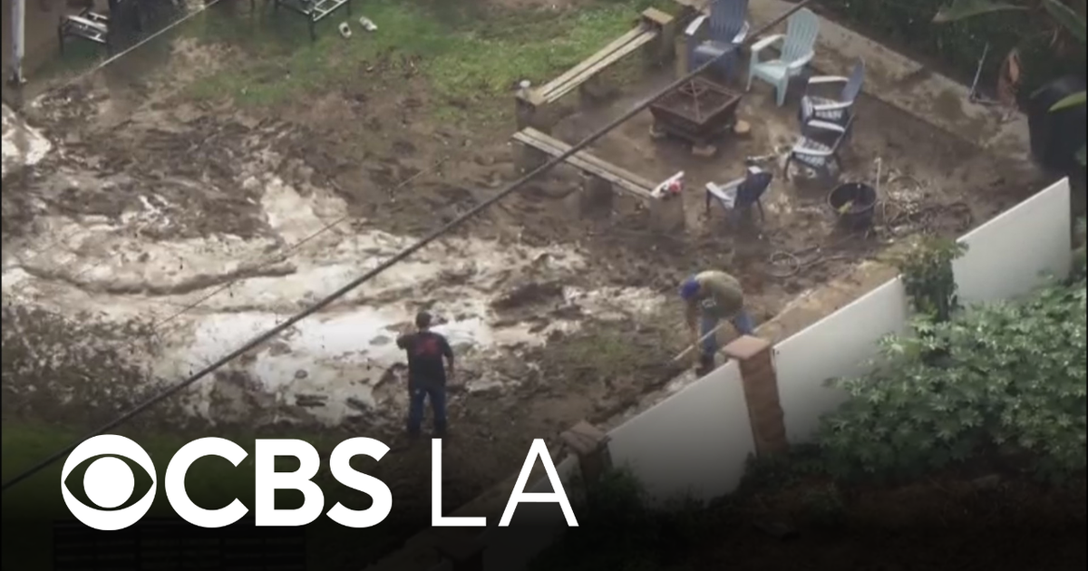 La Habra yards flooded after homeless encampment debris clogs storm drain