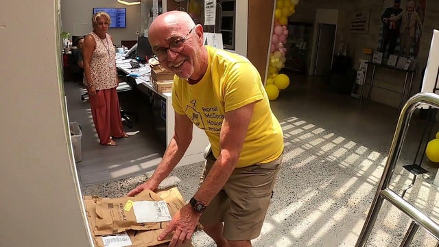 Joe Selfridge organizes packages at the Ronald McDonald House in Philadelphia 