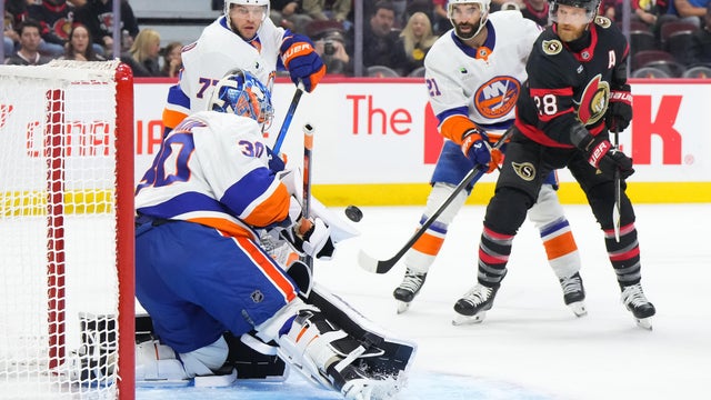 Claude Giroux #28 of the Ottawa Senators battles for the puck with Ilya Sorokin #30, Tony DeAngelo #77 and Kyle Palmieri #21 of the New York Islanders in the first period on October 18, 2025 at Canadian Tire Centre in Ottawa, Ontario, Canada. 