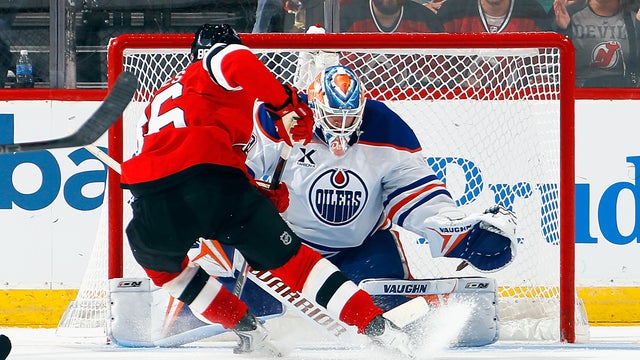 Jack Hughes #86 of the New Jersey Devils scores a third period goal against Calvin Pickard #30 of the Edmonton Oilers at the Prudential Center on October 18, 2025 in Newark, New Jersey. 