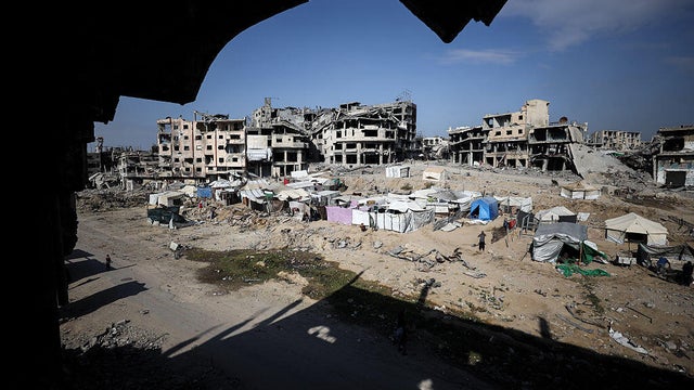 Displaced Palestinians set up tents at Shuja'iyya Junction in Gaza City 