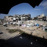 Displaced Palestinians set up tents at Shuja'iyya Junction in Gaza City 