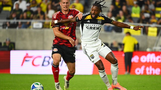 Steven Moreira #31 of the Columbus Crew battles to keep the ball from Gustav Berggren #4 of the New York Red Bulls in the first half of the match at Lower.com Field on October 18, 2025 in Columbus, Ohio. 